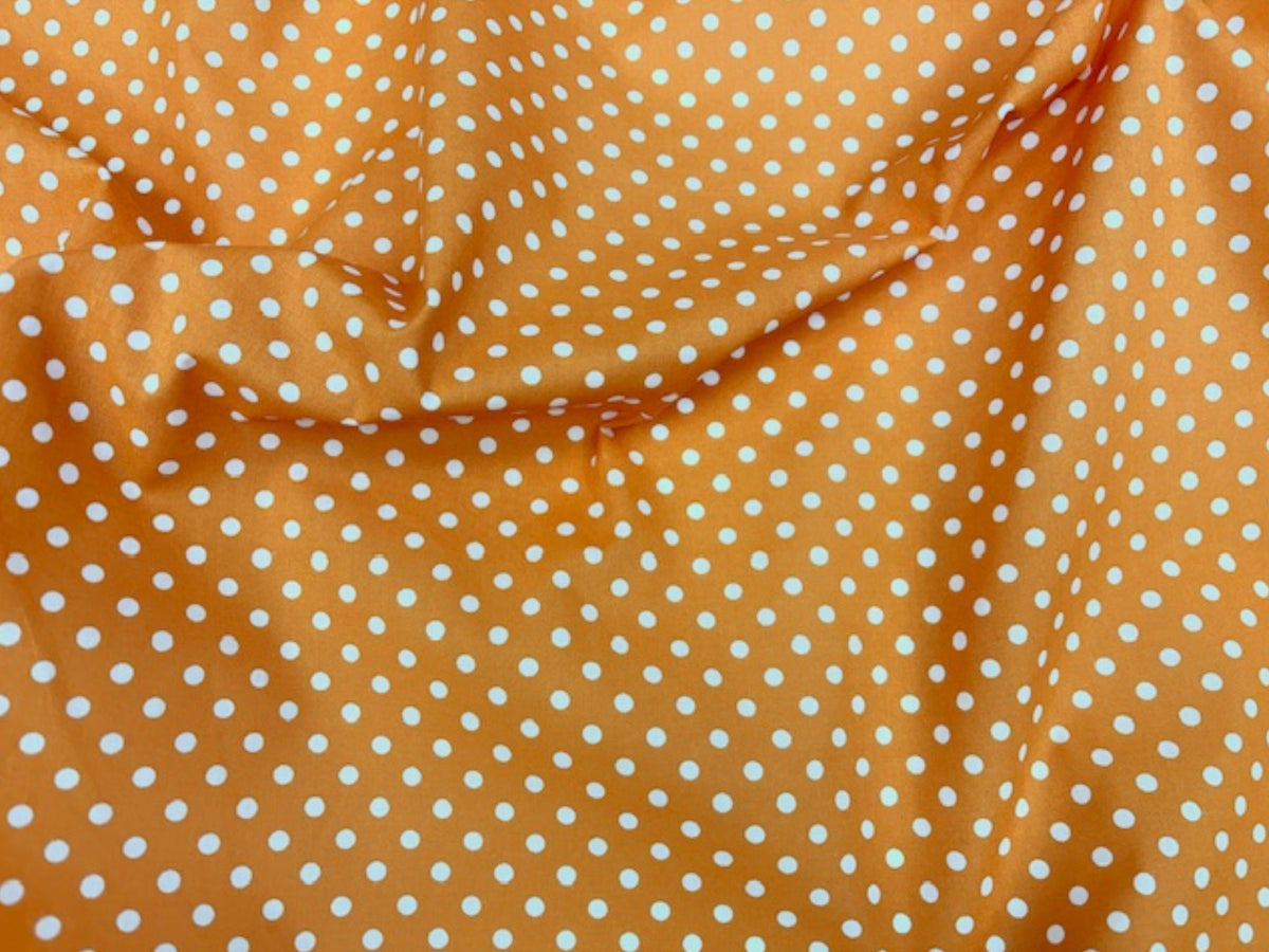 Polka Dots polycotton fabric by Cheap Fabrics featuring a classic black and white polka dot print on soft, lightweight material.