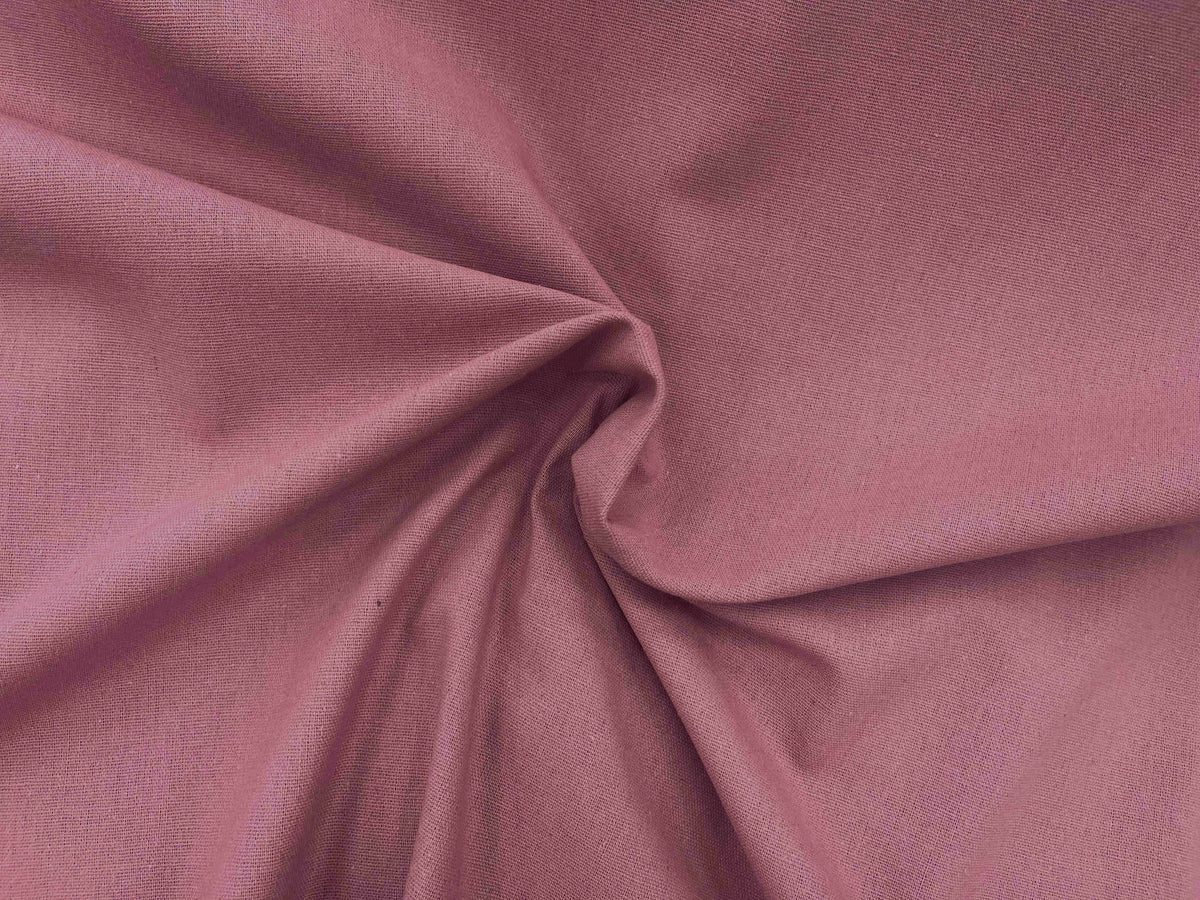 Dusty pink plain faux linen fabric by Cheap Fabrics, showing a soft, smooth linen texture suitable for home decor and crafts.