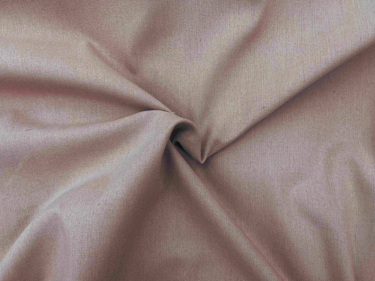 Salmon-colored plain faux linen fabric from Cheap Fabrics, showcasing smooth texture and natural linen appearance.
