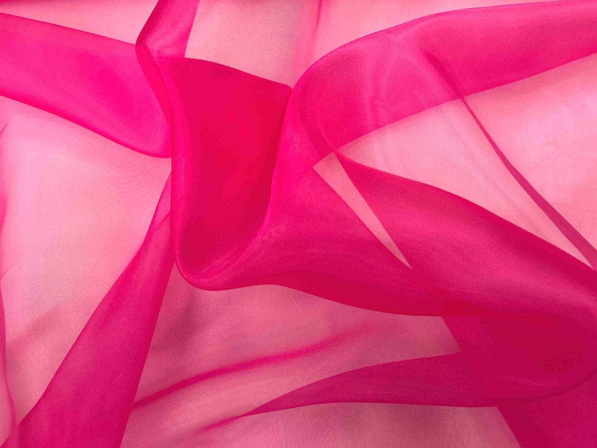 Plain cerise shimmer organza fabric by Cheapfabrics, showcasing its glossy, lightweight, and transparent material for elegant sewing projects.