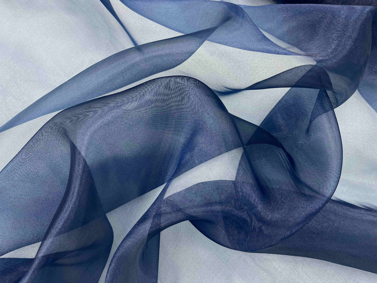 Navy shimmer organza fabric by Cheapfabrics, showing smooth, plain textured sheer organza material with a subtle shimmer finish.