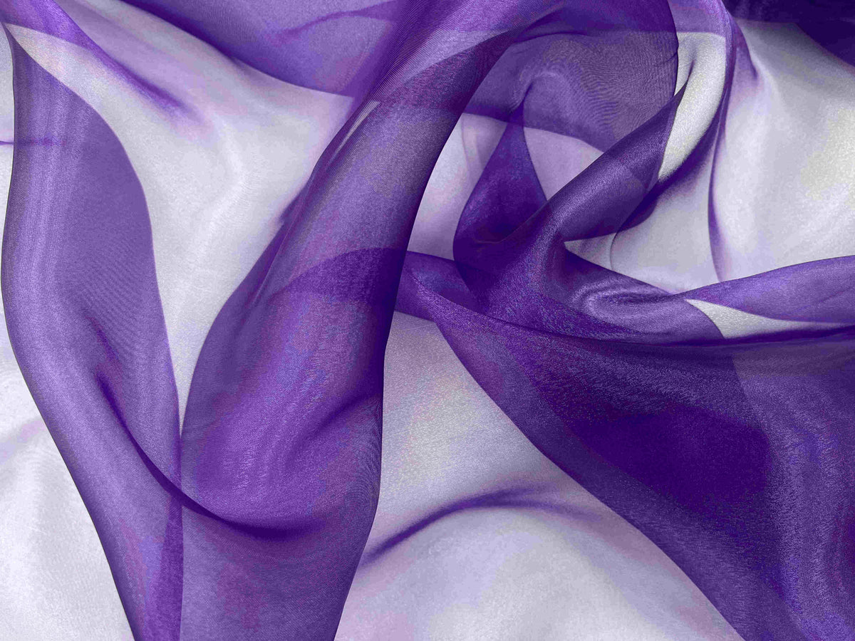 Purple Shimmer Organza fabric from Cheapfabrics, showcasing smooth, translucent material with a subtle shimmering finish.