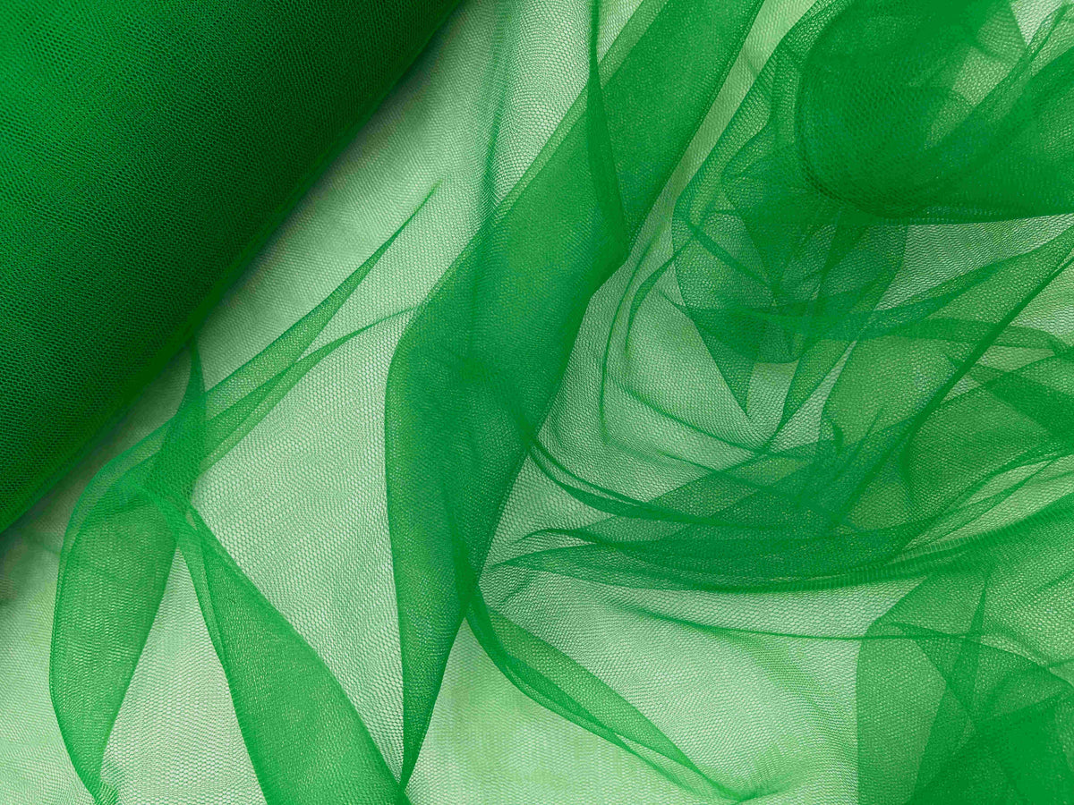 Green plain tulle fabric from Cheap Fabrics, lightweight and sheer material ideal for dresses and craft projects.