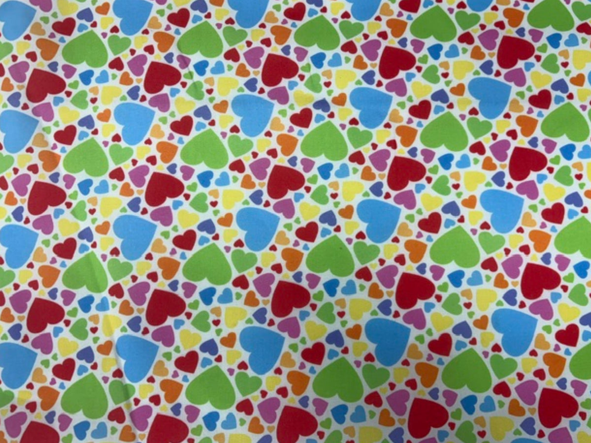Bright Hearts polycotton printed fabric by Cheap Fabrics, featuring colorful heart patterns on a soft poly/cotton blend fabric.