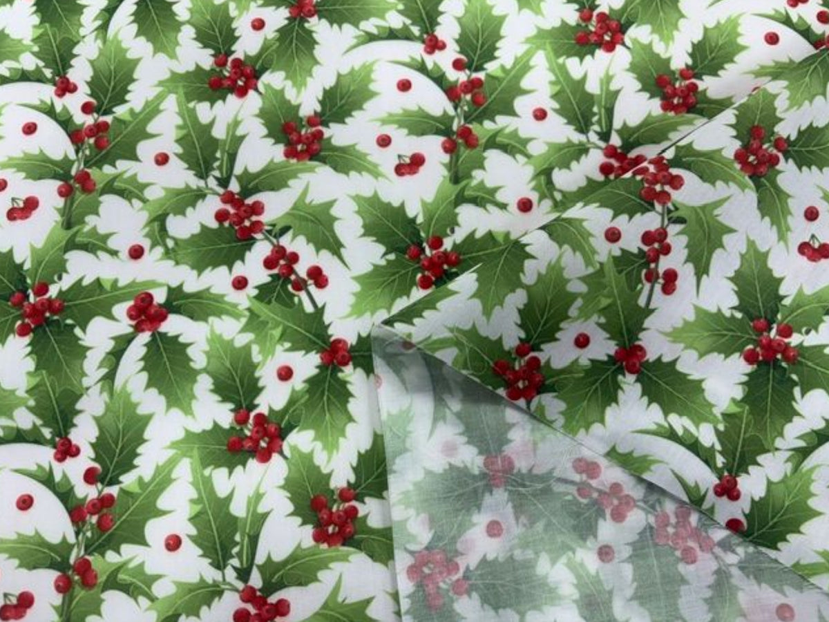 Christmas classic white holly poly/cotton fabric by Cheapfabrics, featuring a festive holly print