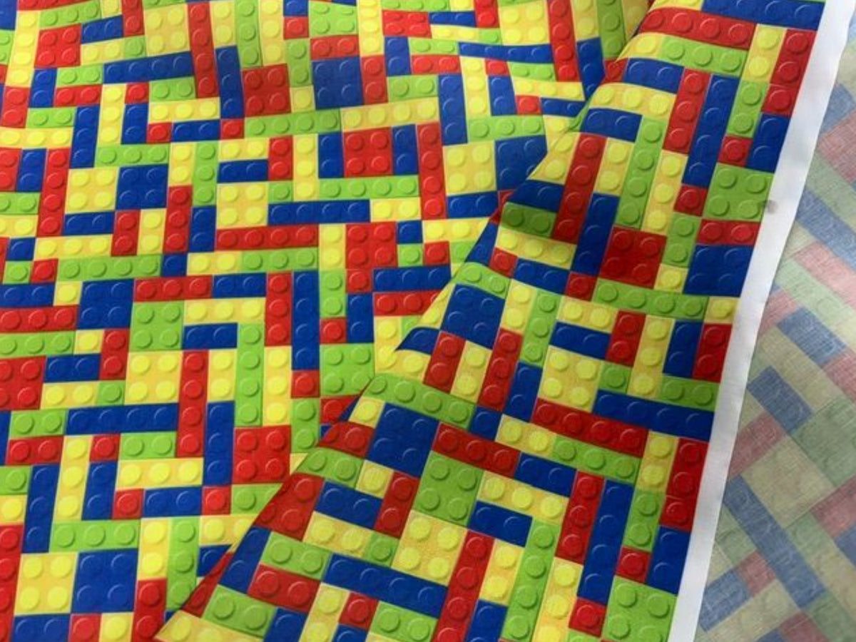 Lego polycotton print fabric by Cheap Fabrics, featuring colorful building block designs