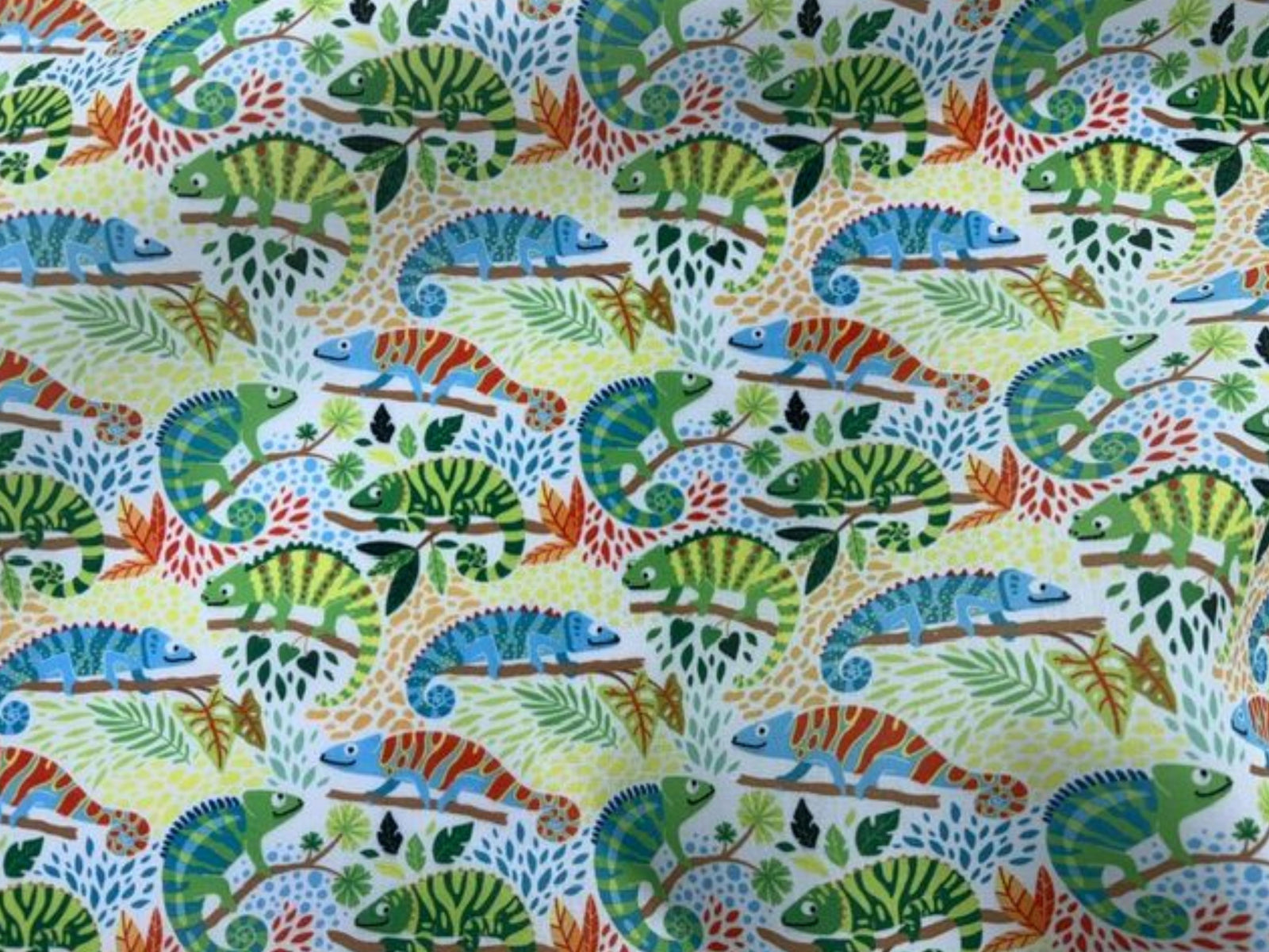 Green reptile print polycotton fabric by Cheap Fabrics