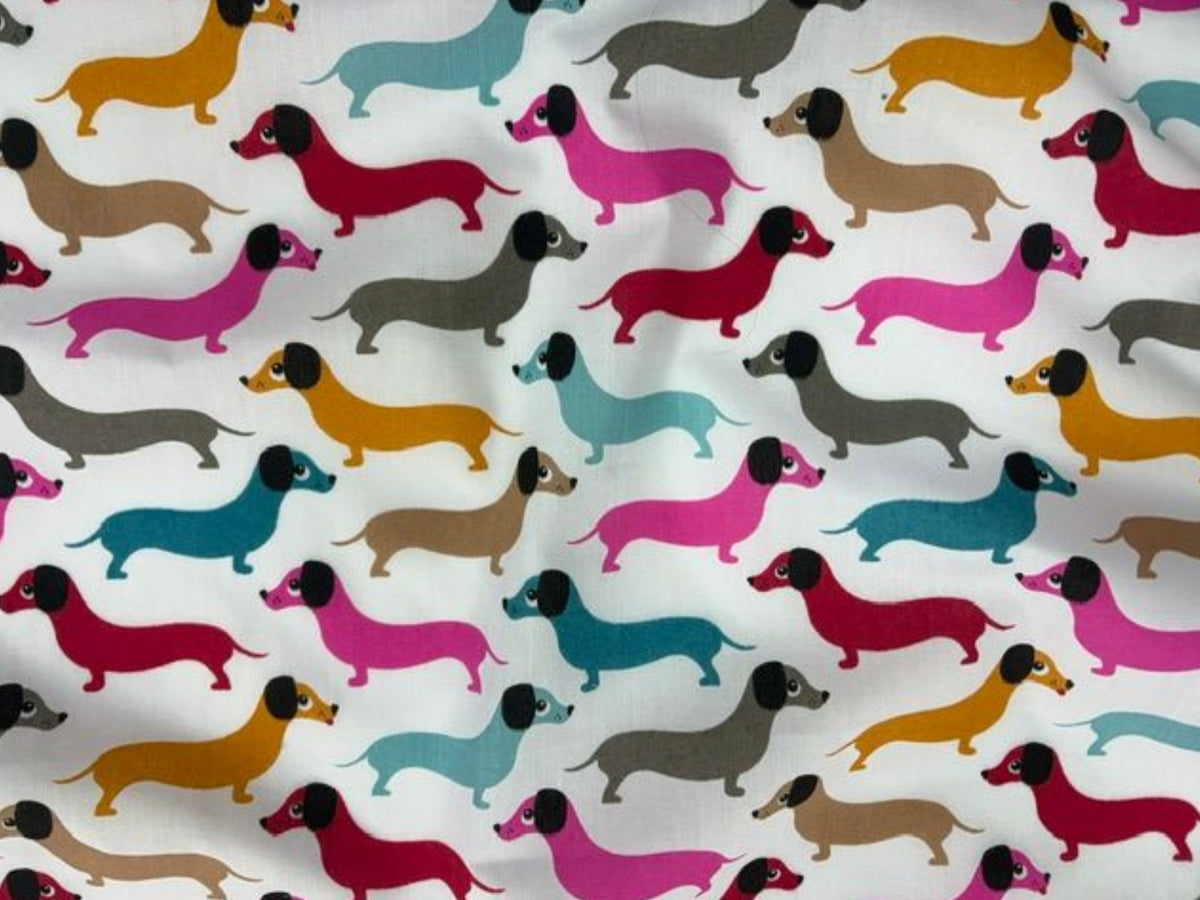 Sausage Dogs polycotton print fabric by Cheapfabrics in bright colors