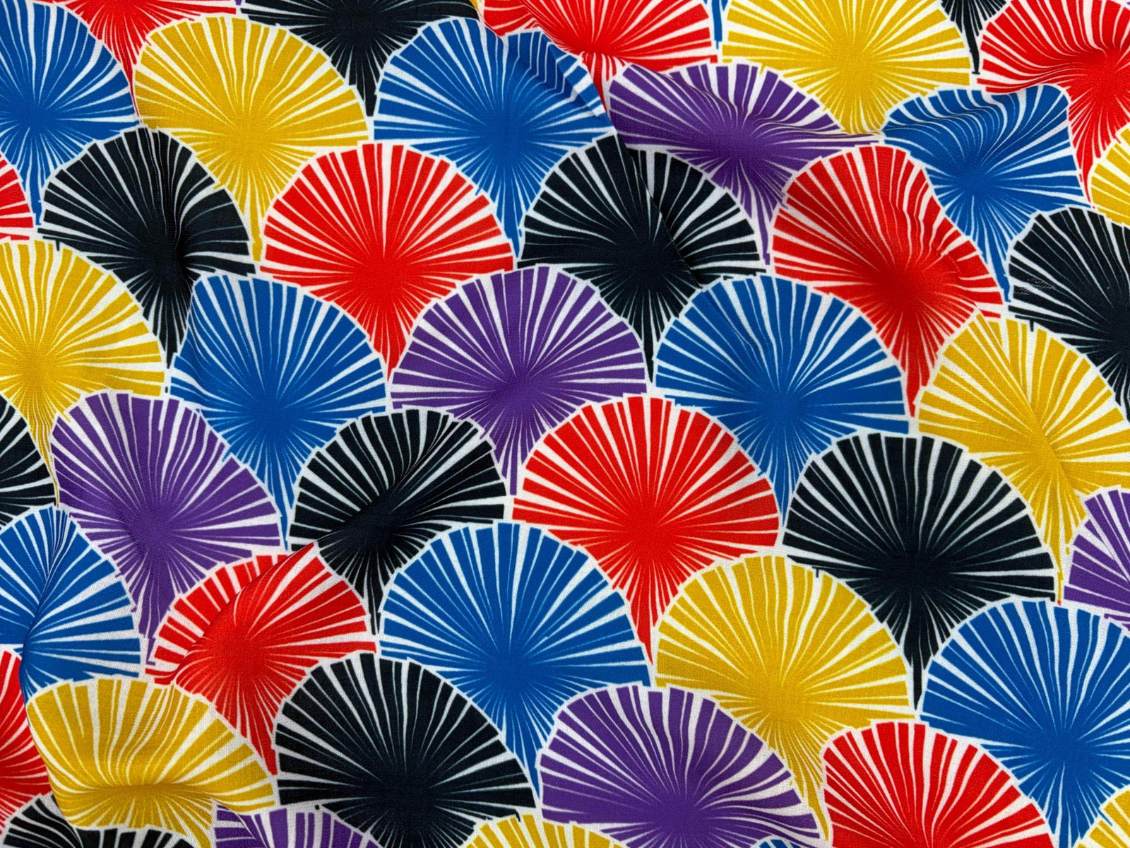 Japanese fan design polyester crepe fabric from Cheap Fabrics, showcasing smooth, lightweight textile with intricate fan pattern.
