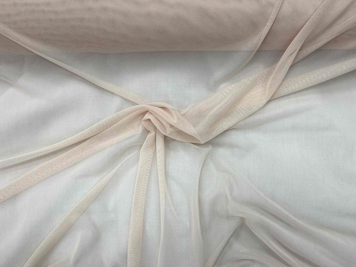 Blush Power Mesh tulle fabric from Cheap Fabrics, featuring lightweight, stretchy material ideal for fashion and craft projects.
