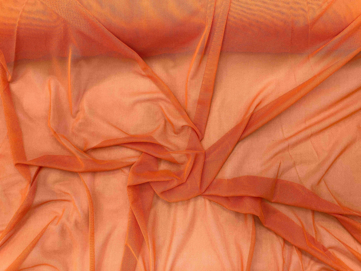 Bright orange power mesh tulle fabric by Cheap Fabrics, showcasing a stretchable and lightweight material suitable for fashion and craft projects.