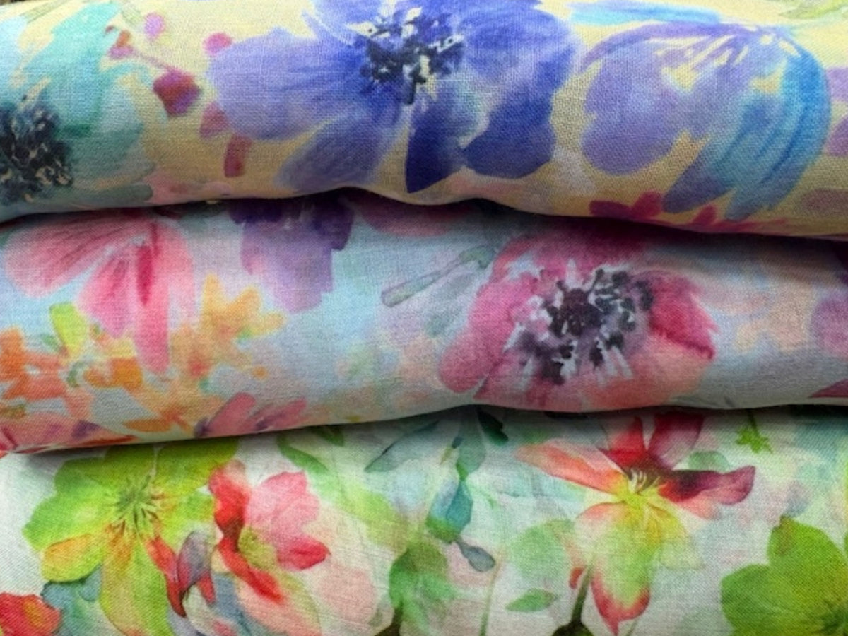 Printed voile fabric with watercolor floral pattern, lightweight and sheer, ideal for curtains or garments from Cheapfabrics.