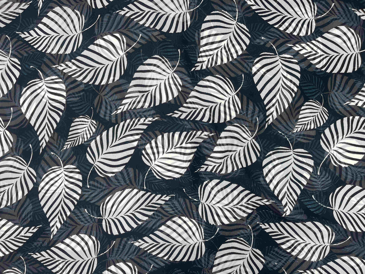 Printed chiffon fabric from Cheap Fabrics Monotone Collection, showing a lightweight, flowy chiffon material with leaf pattern design.