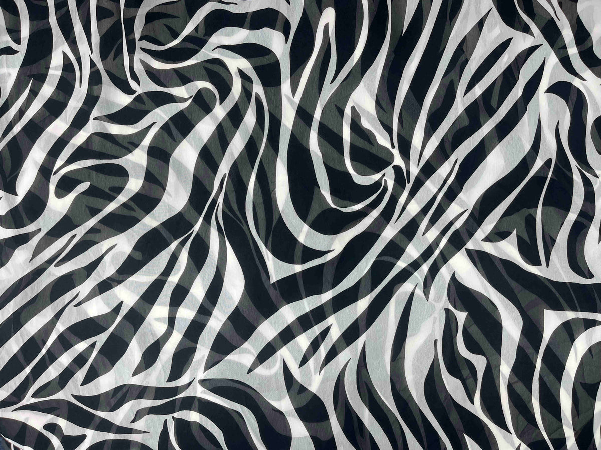 Printed chiffon fabric from Cheap Fabrics featuring a monochrome zebra print pattern.