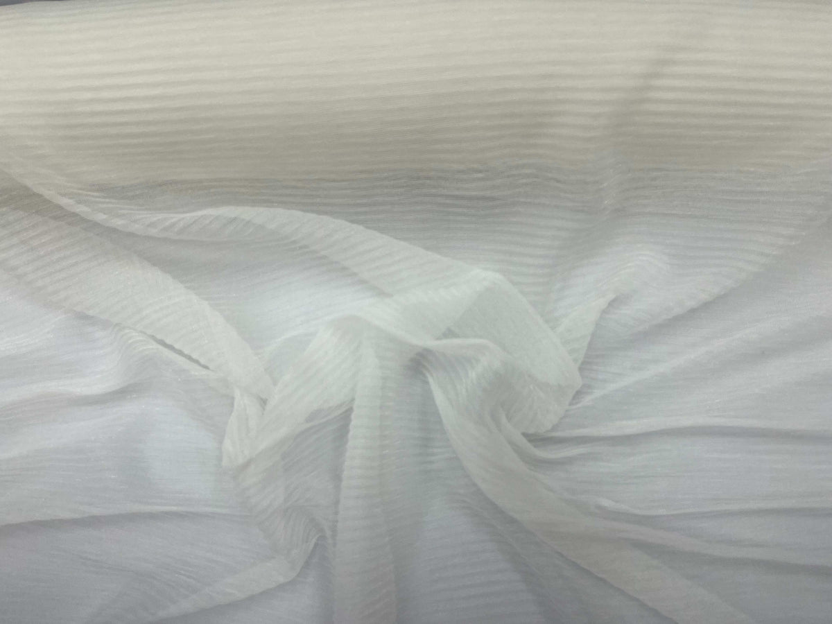 Ivory ribbed metal chiffon knit fabric by Cheap Fabrics, showcasing its lightweight, textured chiffon material with metallic sheen.