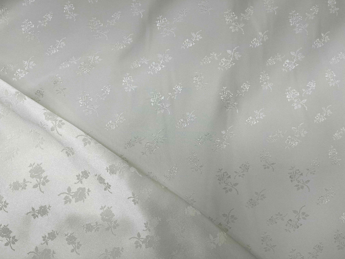 Cream satin-backed jacquard fabric featuring elegant English Rose pattern, by Cheapfabrics, suitable for upholstery or fashion projects.