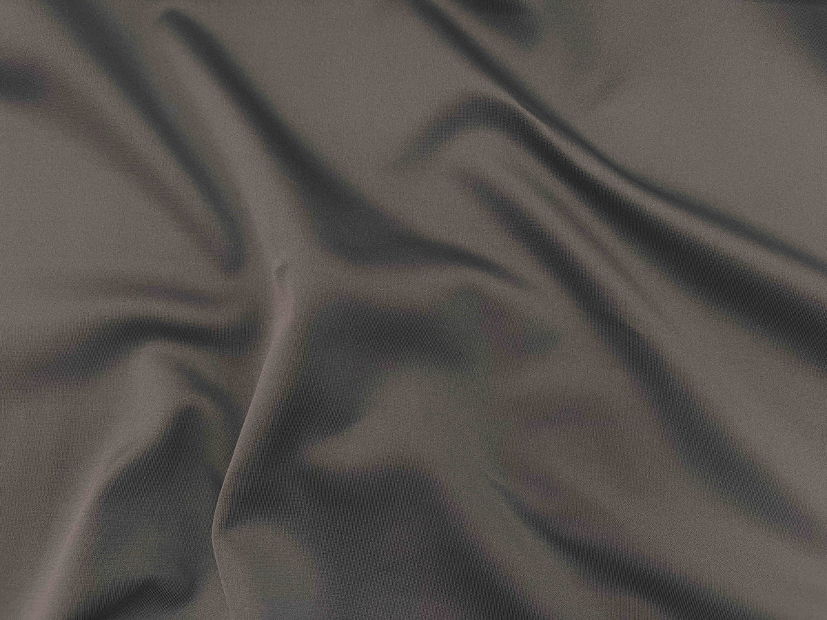Brown plain scuba fabric from Cheapfabrics, close-up of smooth, stretchy textile suitable for garments and craft projects.