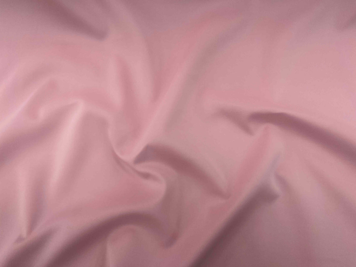 Pastel pink Plain Scuba Fabric from Cheapfabrics, smooth and stretchy material ideal for sewing and fashion projects.