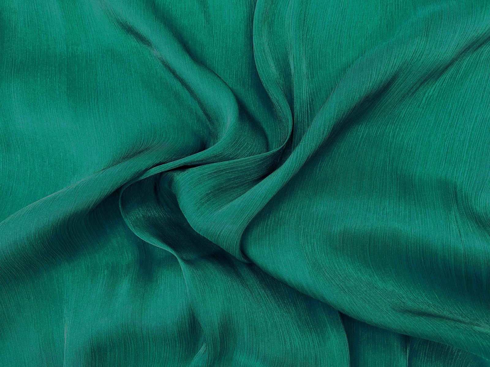 Forest green shimmer satin chiffon fabric by Cheap Fabrics, showcasing smooth, shiny, lightweight chiffon material with a shimmering finish.