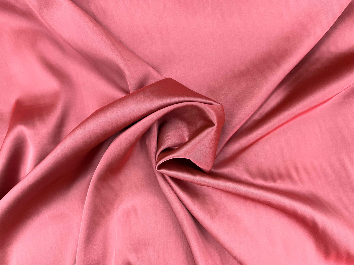 Coral and black satin fabric by Cheap Fabrics, showcasing smooth, shiny satin material with a sleek texture.