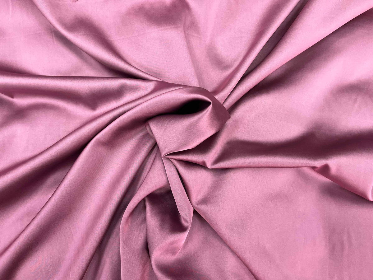 Pink and black satin fabric from Cheap Fabrics, smooth and shiny shot Slinky Satin Fabric for elegant sewing projects.