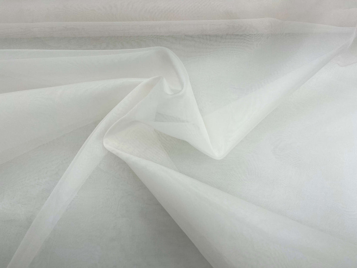 Ivory silk organza fabric by Cheap Fabrics, showing a smooth, sheer silk material with a delicate, lightweight texture.