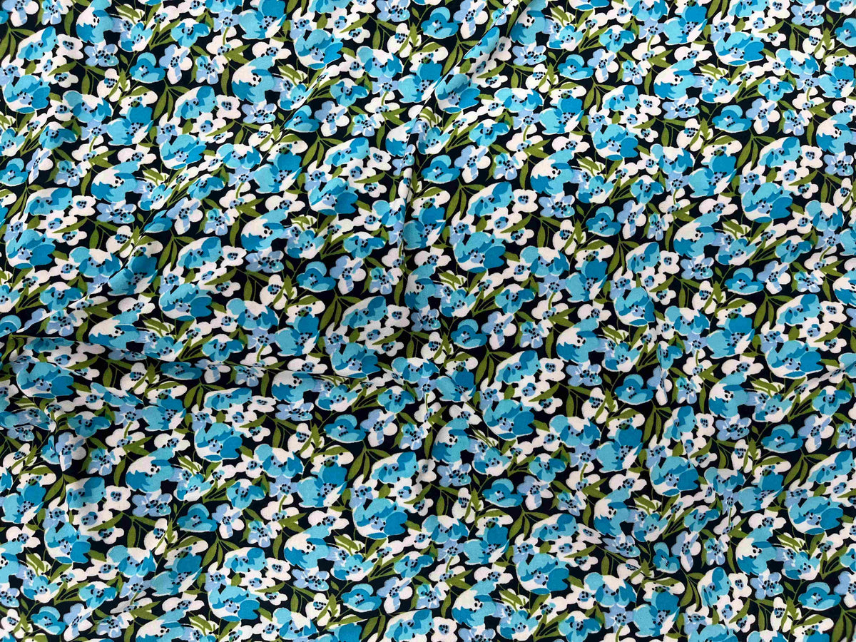 Small floral printed jersey fabric by Cheapfabrics, featuring a colorful floral design on soft jersey material.