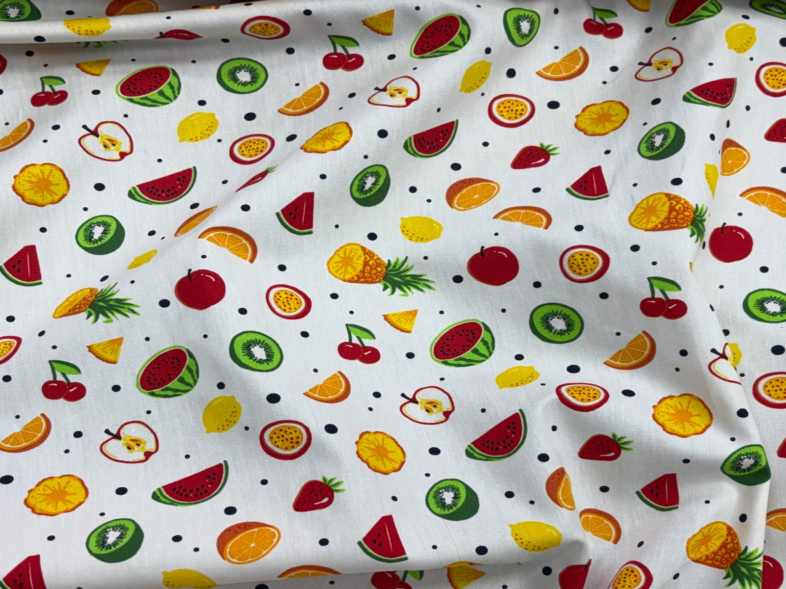 So Fruity cotton poplin patchwork fabric with vibrant fruit patterns and colorful designs in a textured weave.