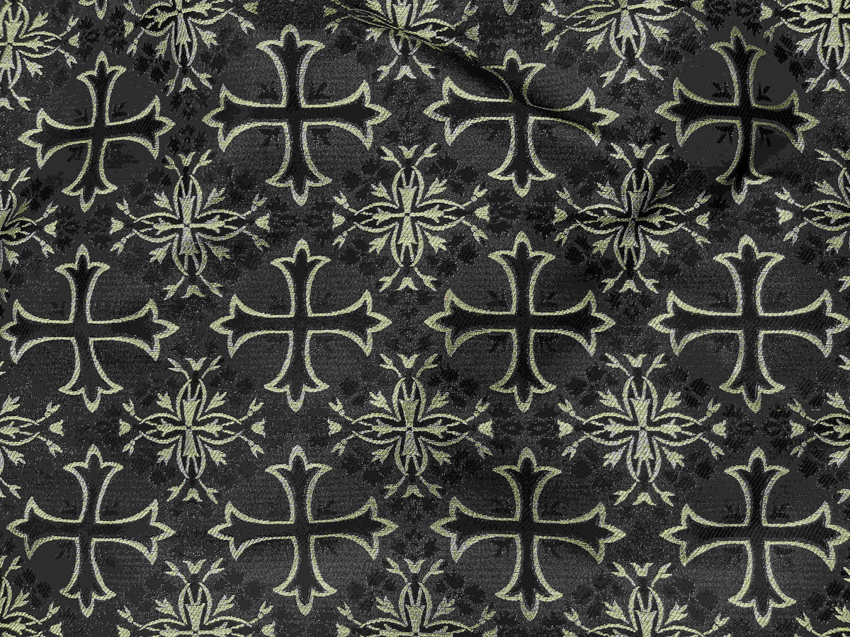 Black and gold spiritual brocade fabric with a detailed cross design, showcasing luxurious woven pattern by Cheap Fabrics.