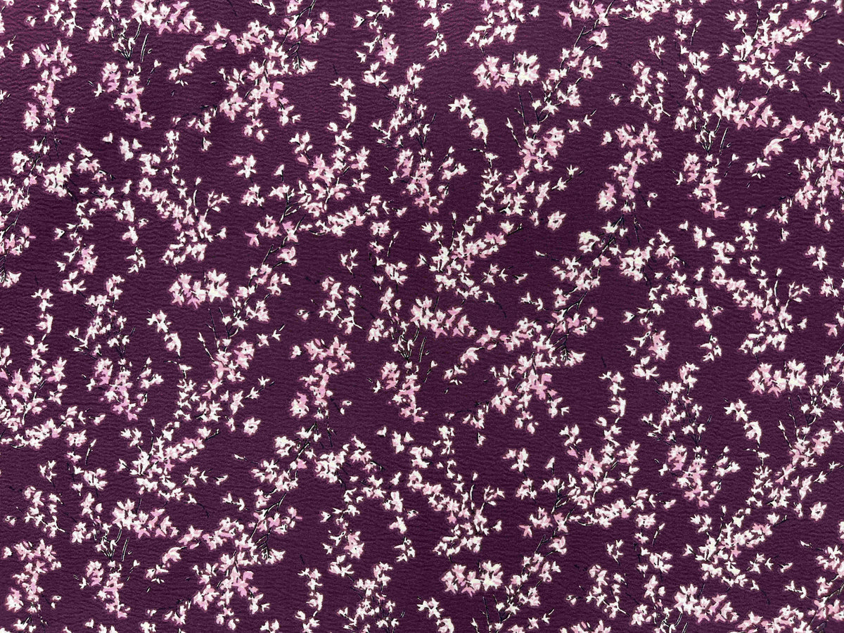 Textured Stretch Crepe Fabric Whisper by Cheap Fabrics, featuring soft, textured berry-colored crepe fabric for clothing and crafts.