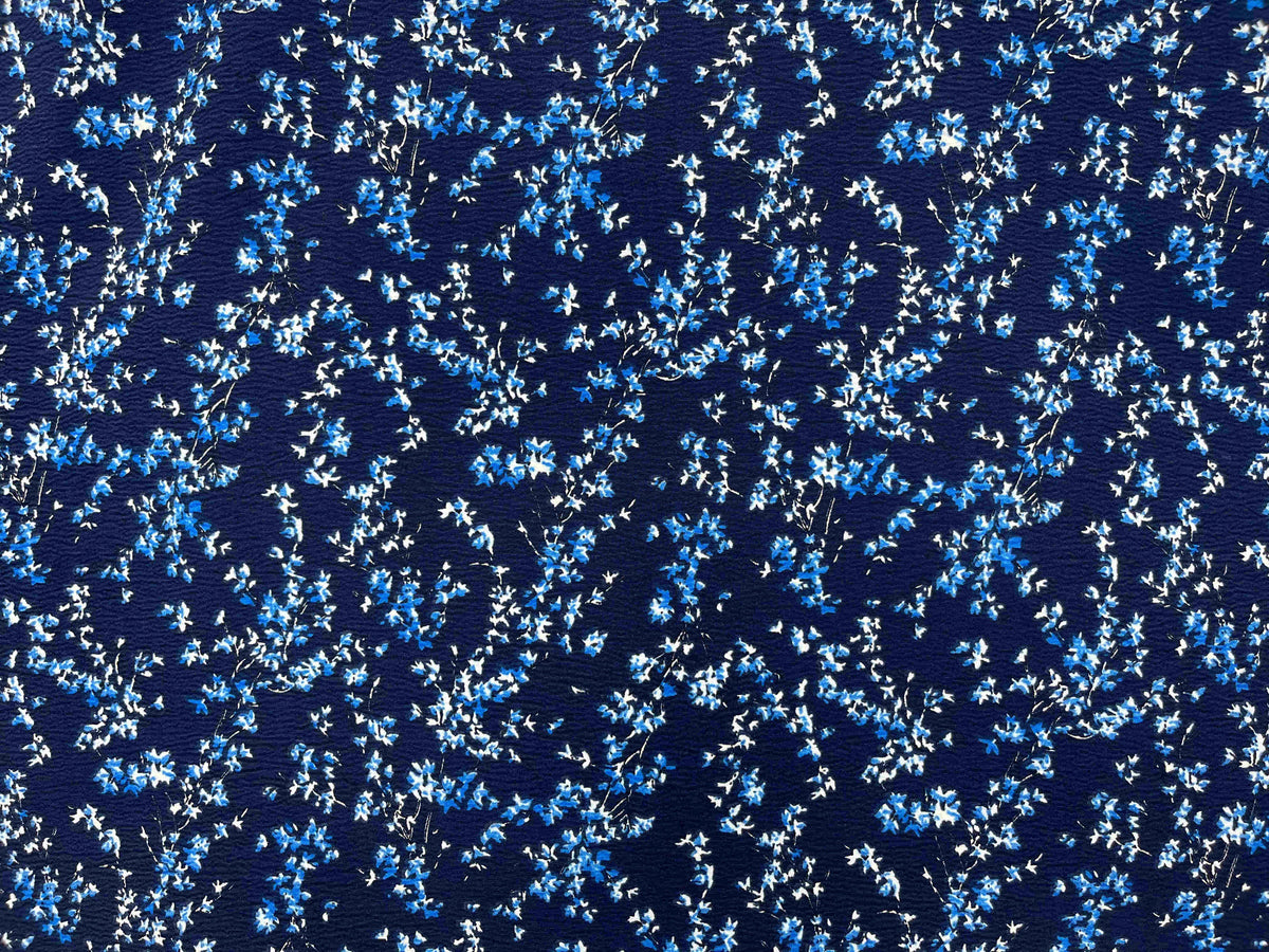 Navy textured stretch crepe fabric named Whisper by Cheap Fabrics, showing its detailed surface and flexible texture.
