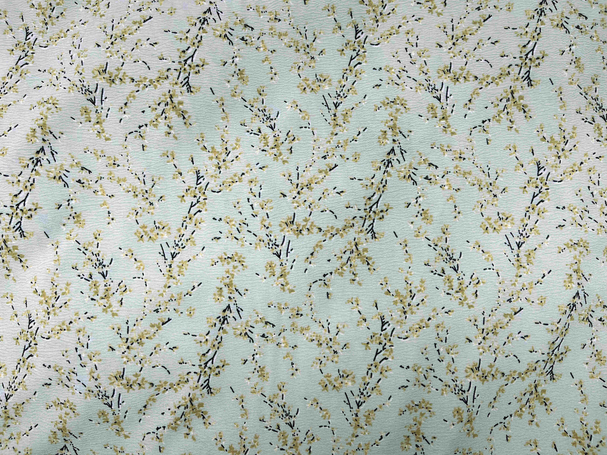 Pale green textured stretch crepe fabric by Cheap Fabrics, showcasing its soft, woven surface and flexible, lightweight material.