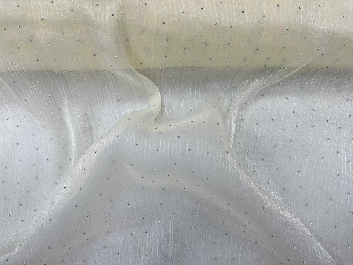 Cream Twinkle Stone Organza Fabric by Cheap Fabrics, showcasing lightweight, shimmering sheer material with delicate texture.