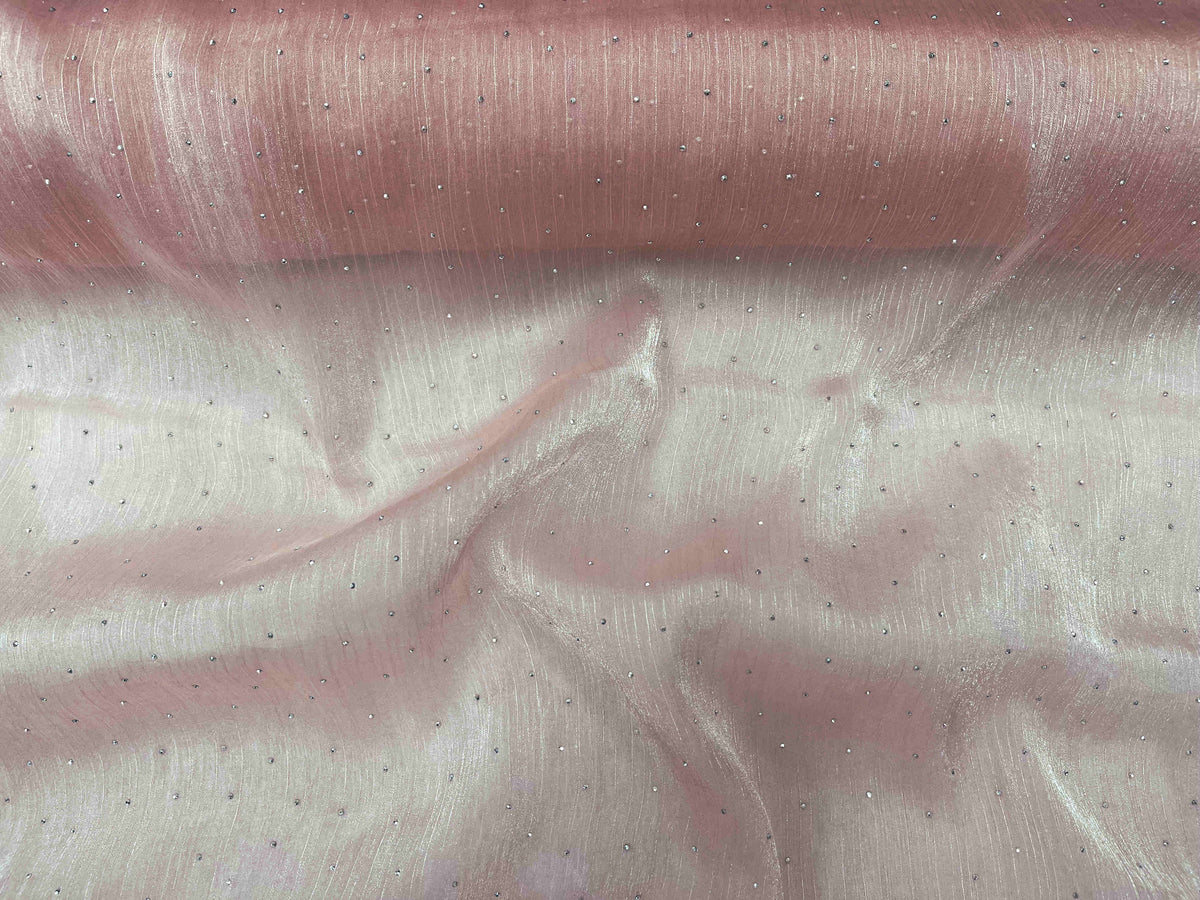 Pastel pink Twinkle Stone organza fabric by Cheap Fabrics showcasing a delicate, shimmering sheer textile for elegant designs.