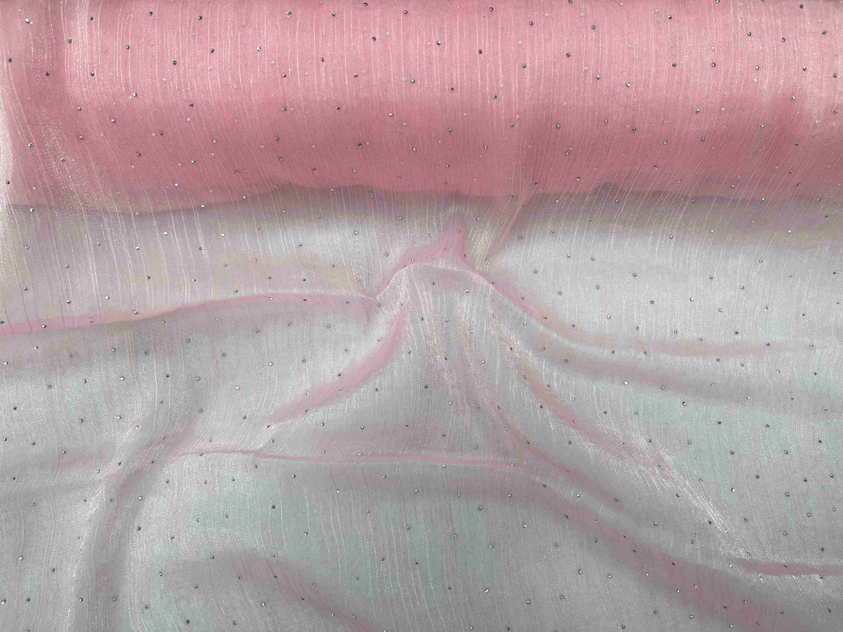 Pink Twinkle Stone Organza Fabric by Cheap Fabrics, showcasing a delicate, shimmering sheer textile with sparkling accents.