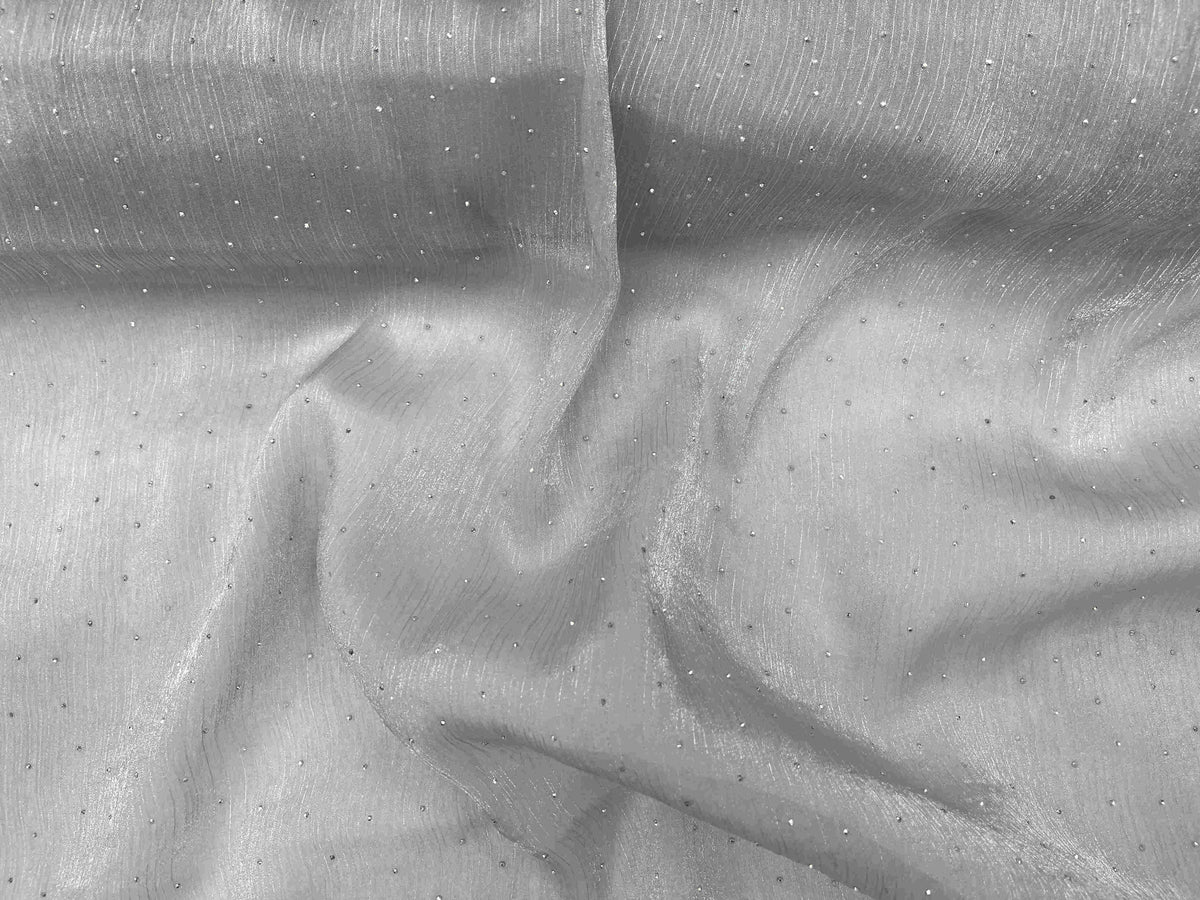 Silver Twinkle Stone Organza Fabric by Cheap Fabrics, showcasing shimmering, lightweight sheer material with sparkling accents.