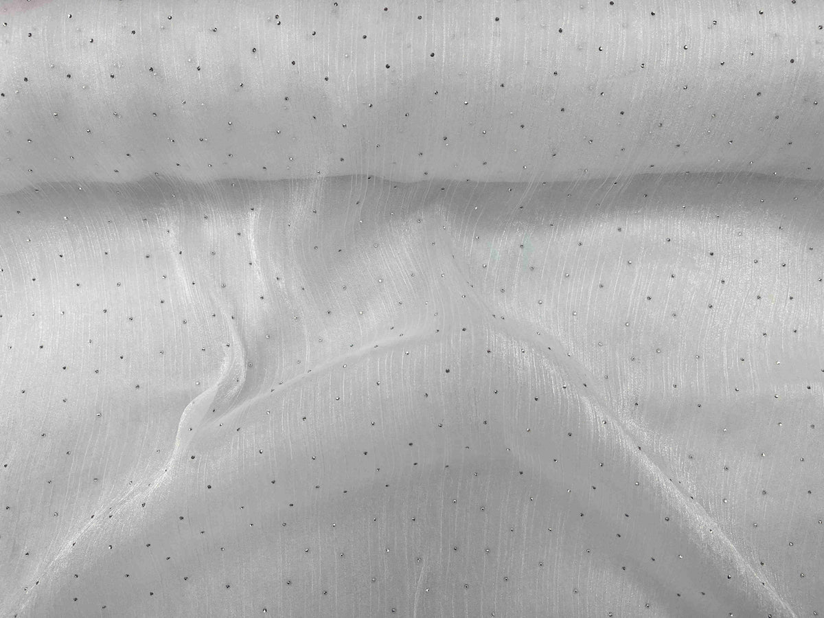 White Twinkle Stone Organza Fabric by Cheap Fabrics showcasing shimmering, lightweight, sheer material ideal for elegant garments and decor.