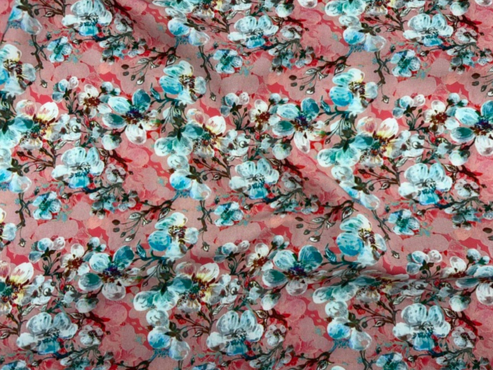 Aqua-colored viscose fabric with a budding floral print from Cheap Fabrics, showcasing a soft, lightweight textile perfect for garments.