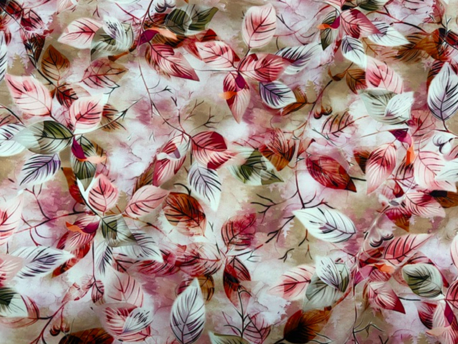 Sage-colored Deluxe Printed Viscose Fabric with leaf pattern from Cheap Fabrics, showcasing smooth, lightweight textile with botanical print.