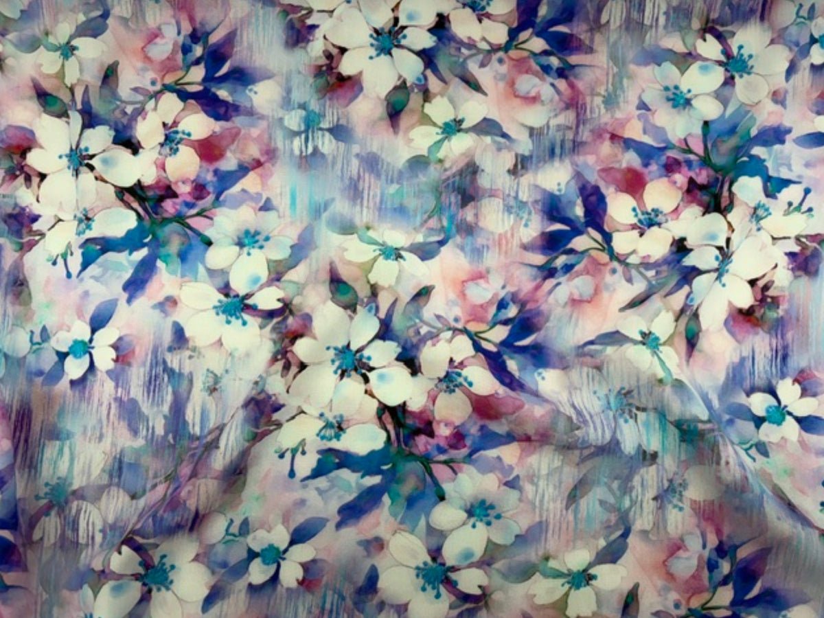 Royal blue viscose fabric with fluid floral print from Cheap Fabrics, showcasing soft, lightweight material ideal for clothing or textiles.