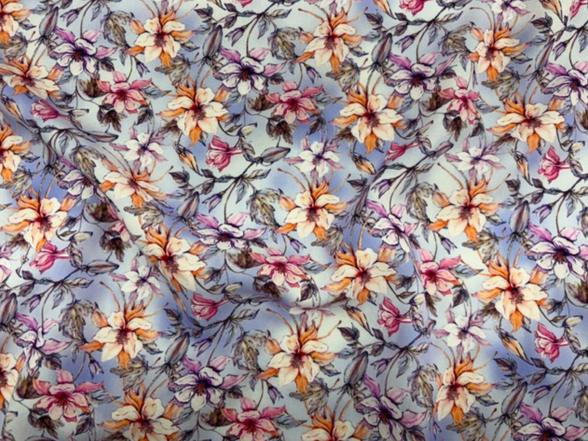 Deluxe printed viscose fabric in pastel meadow lilac with floral print, showcasing soft, lightweight material from Cheap Fabrics.