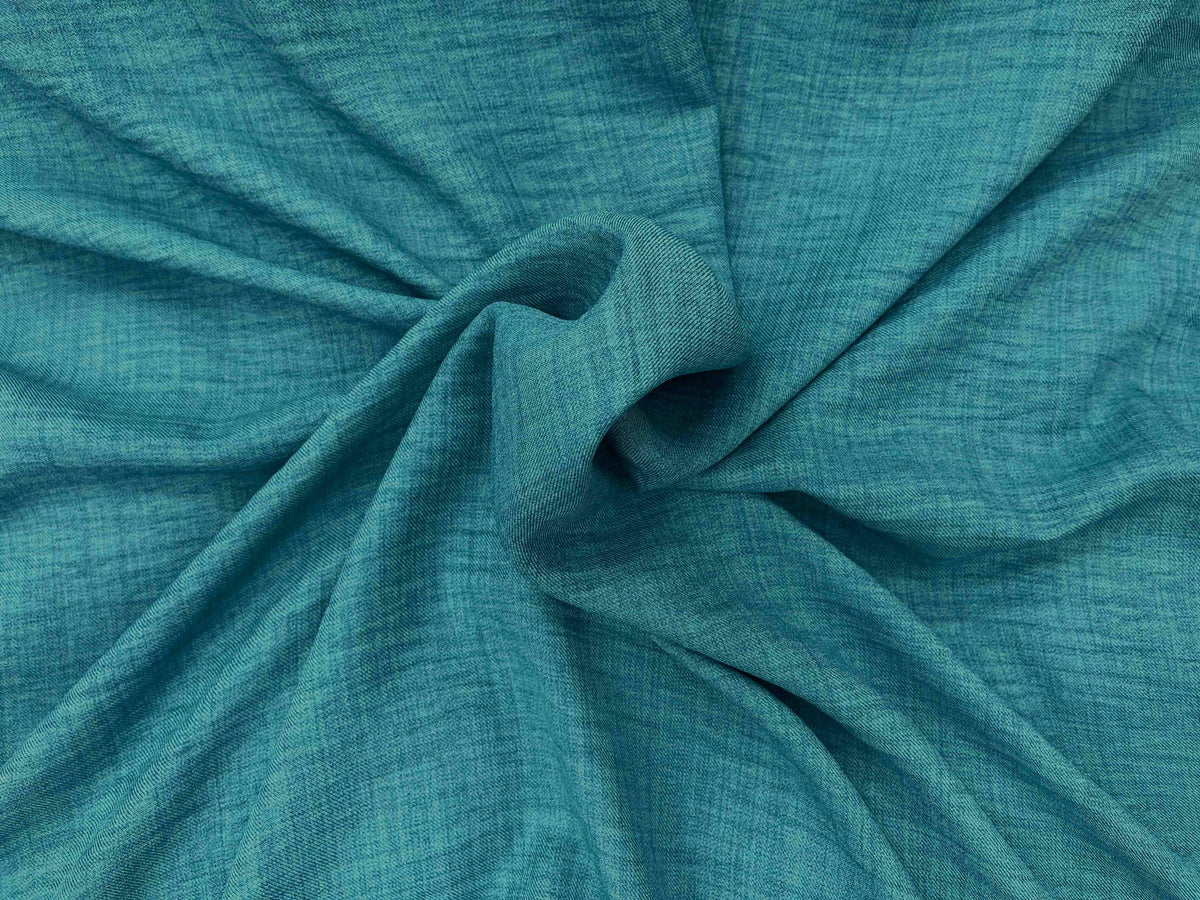 Washed melange crepe fabric in jade color from Cheapfabrics, showing soft, textured woven material suitable for garments and crafts.