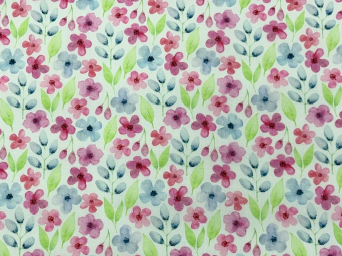 Soft watercolour flower print on white polycotton fabric by Cheap Fabrics, showcasing delicate floral watercolor design.