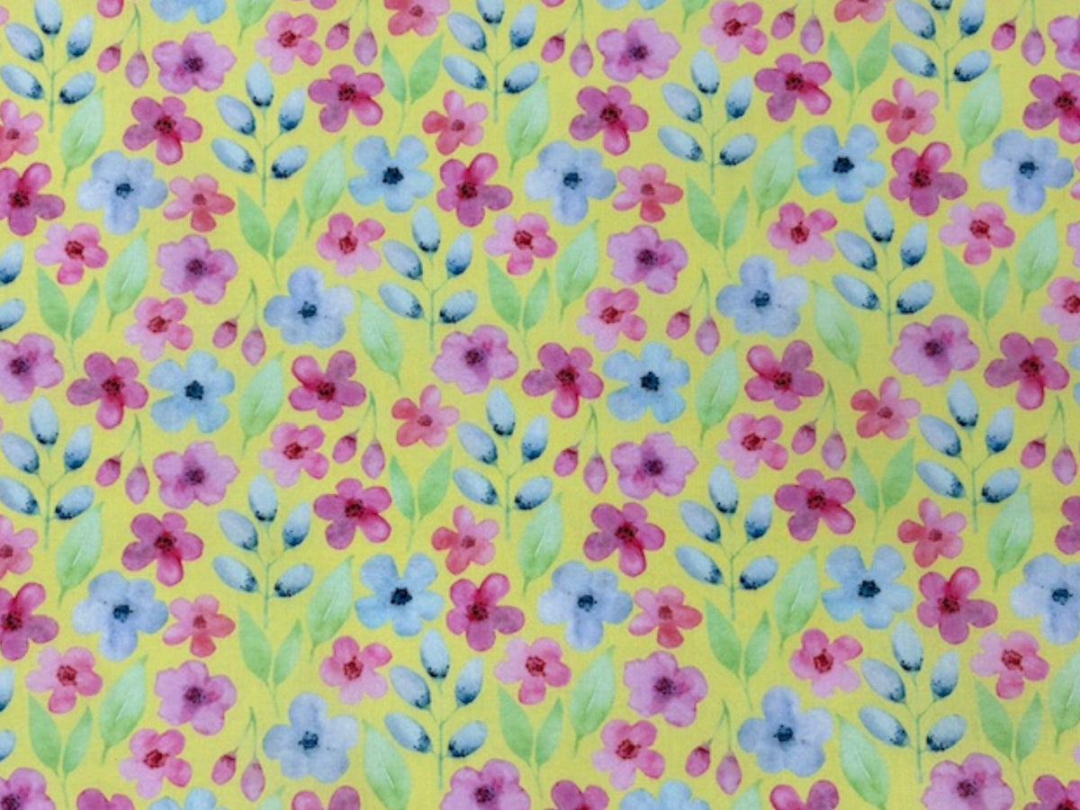Soft watercolour flowers on yellow polycotton fabric, featuring a floral print from Cheap Fabrics for quilting or crafting projects.